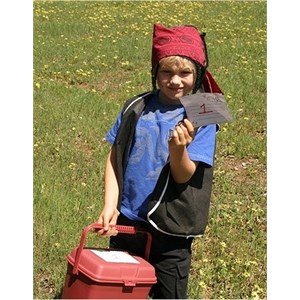 A kid carrying a container