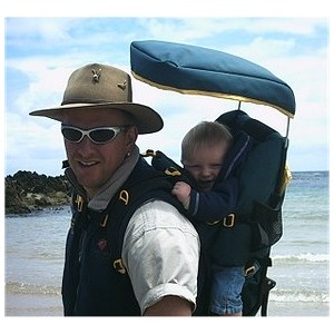 A baby in a back carrier