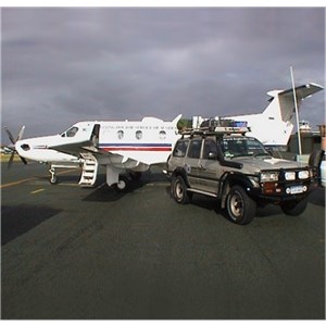 ExplorOz 4WD next to a RFDS plane