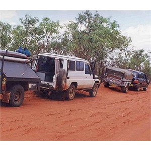 A convoy of 4WDs towing trailers