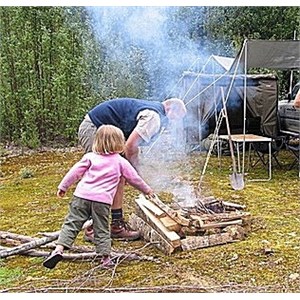 Helping with building the open wood fire