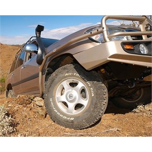 Side rails protecting a 100 Series Landcruiser