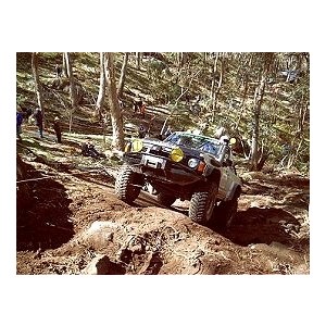 The vehicle is winched to the top of the hill