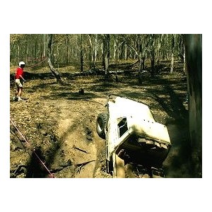 The vehicle is winched to the top of the climb