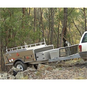 A Kamparoo BRUMBY by Cub Campers being towed up a rocky hill