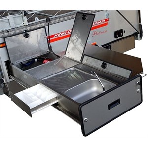 A slide-out camper trailer kitchen