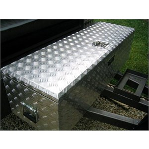 An aluminium toolbox mounted at the front of a camper trailer
