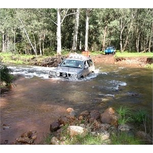4WD crossing a stream