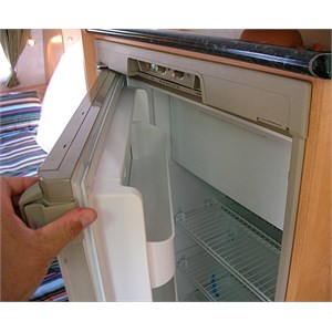 Opening a fridge in a caravan