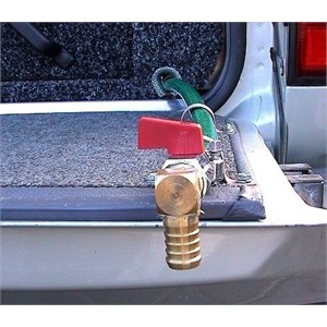 The outlet valve on a stainless steel water tank