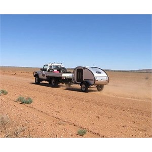 Off road teardrop camper being towed on the Birdsville track