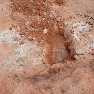The rock sheet suppooerting the spring and soaks.