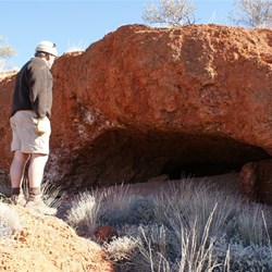 Alan and one of the many caves at Hanns Tabletop Hill