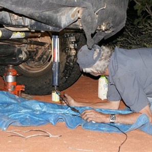 John about to insert plug number 9 into the gash in the Toyo