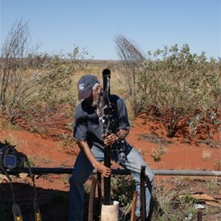 John lifting water from the bore.