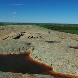 Pools of water on top of the rock