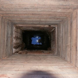 Peering down the restored well 49 - CSR