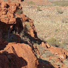 Rocky Ramparts emerging from the sand.