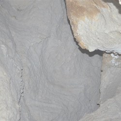 Inside a deep cave, looking up
