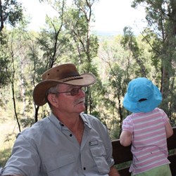 Bruce relaxing while Peta checks out the view from the seat on the boardwalk