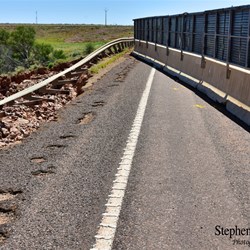 The damage to the Stuart Highway at Woocalla Creek.