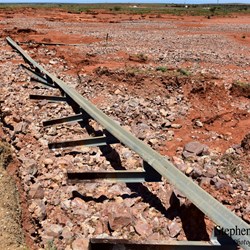 Armco Railing Barrier twisted and ripped from the road by the floodwaters