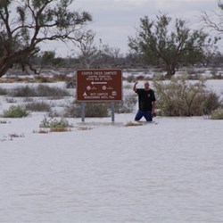 Greendog Showing how deep the water was at the Sign