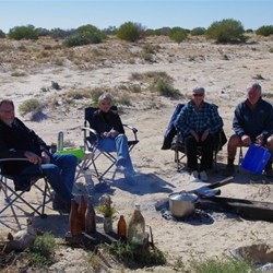 Around the fire while the yabbies cook