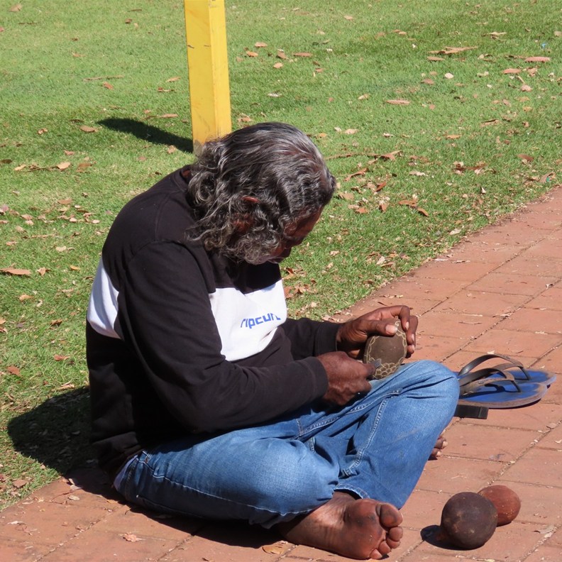 Man Carving a Boab Nut