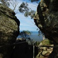 nearly at the top now - glimpses of the coastline through boulders