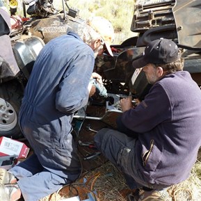 Scotty and John attending to the damaged belt.