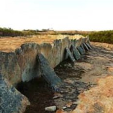 Walls to channel water into the dam