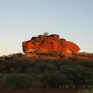 The rising sun casting light on Nipper Pinnacle.