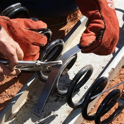 Bending the strap around the coil