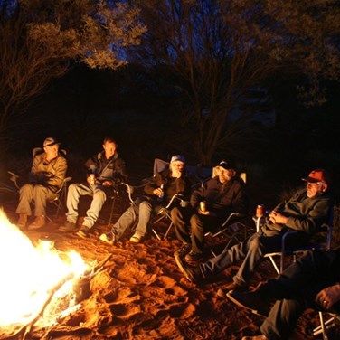 Debrief around the fire