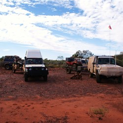 The cairn of stones at the western end of the grassy plain