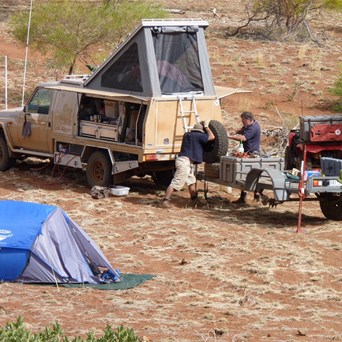 Mick O and Outback Al mending the trailer tyre.