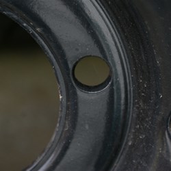 Speedie Brand Steel rim - Note lack of internal tapering in hole.