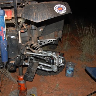Suzette crocheting a new rear CV boot for the quad.