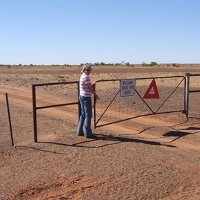 Fiona opening one of the gates on the way to Old Andado