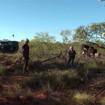 Gaby and John deciding on the best location for the fire.
