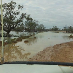 Etadunna Station vehicle on the flooding Birdsville Track