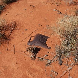 An old jerrycan being claimed by the desert sands