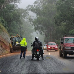 one lane closed on Highway to repair damage to road after heavy rain