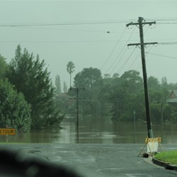 The swollen Bega river blocks the Highway