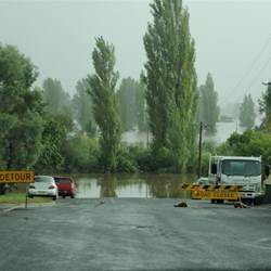 the swollen river at Bega and detour signs
