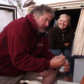 Chef at work with Canadian kitchen hand watching