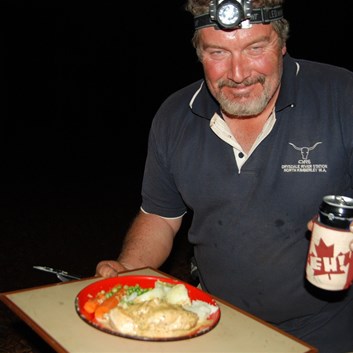 The chef about to enjoy his dinner and a bevvy