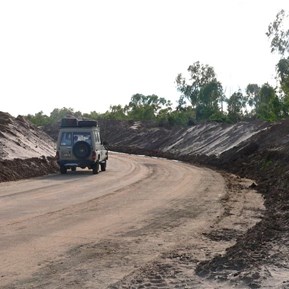 Huge banks of sand that had been removed from the road.