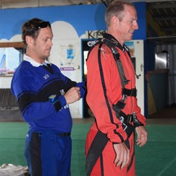 Getting straped into the harness